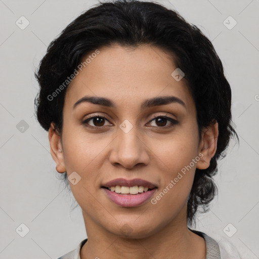 Joyful latino young-adult female with short  black hair and brown eyes