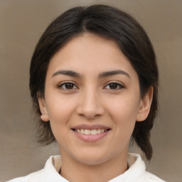 Joyful white young-adult female with medium  brown hair and brown eyes