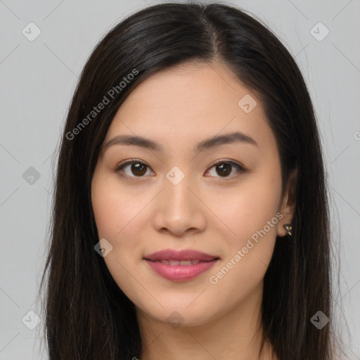 Joyful asian young-adult female with long  brown hair and brown eyes