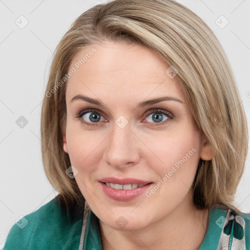 Joyful white young-adult female with medium  brown hair and blue eyes