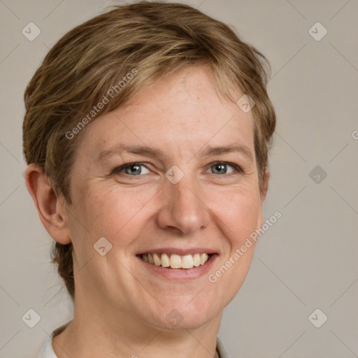 Joyful white adult female with short  brown hair and grey eyes