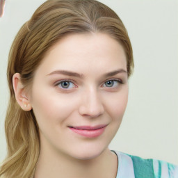 Joyful white young-adult female with medium  brown hair and green eyes