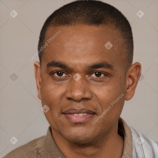 Joyful latino adult male with short  brown hair and brown eyes