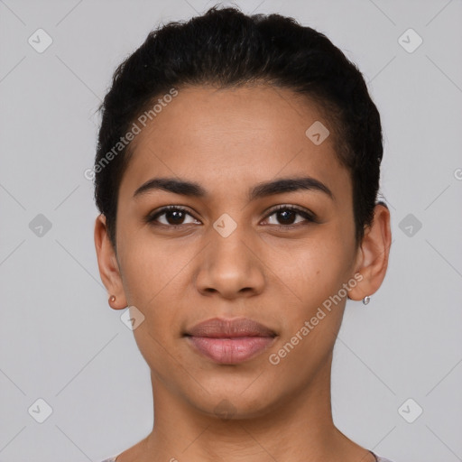 Joyful latino young-adult female with short  black hair and brown eyes