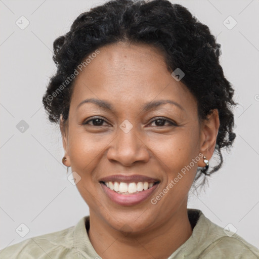 Joyful latino adult female with short  brown hair and brown eyes