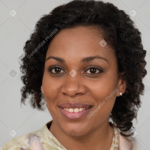 Joyful black adult female with medium  brown hair and brown eyes