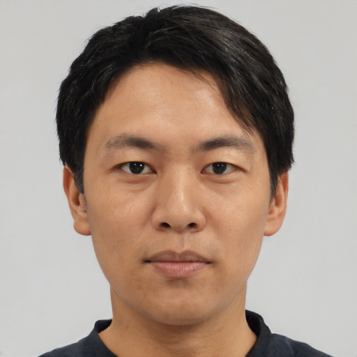 Neutral asian adult male with short  black hair and brown eyes