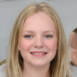 Joyful white young-adult female with long  brown hair and blue eyes