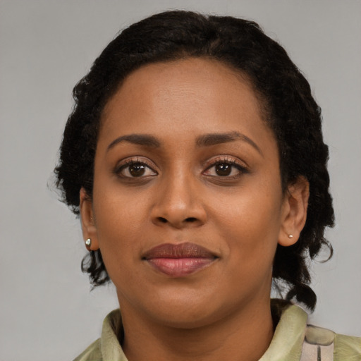 Joyful latino young-adult female with medium  black hair and brown eyes