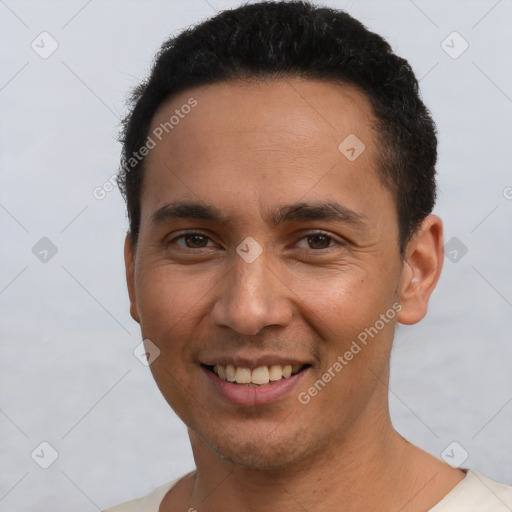 Joyful white young-adult male with short  black hair and brown eyes