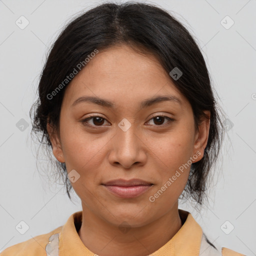 Joyful latino young-adult female with medium  brown hair and brown eyes