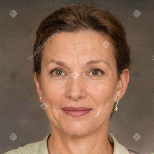 Joyful white adult female with short  brown hair and grey eyes