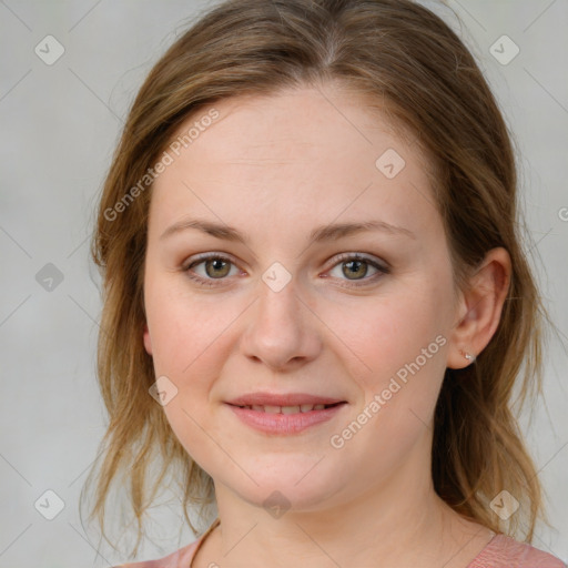 Joyful white young-adult female with medium  brown hair and blue eyes