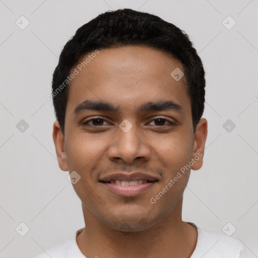 Joyful latino young-adult male with short  black hair and brown eyes