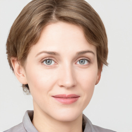 Joyful white young-adult female with medium  brown hair and grey eyes