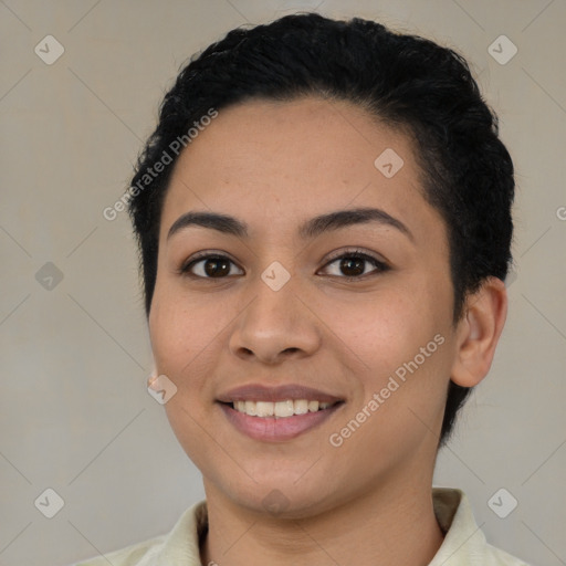 Joyful latino young-adult female with short  brown hair and brown eyes