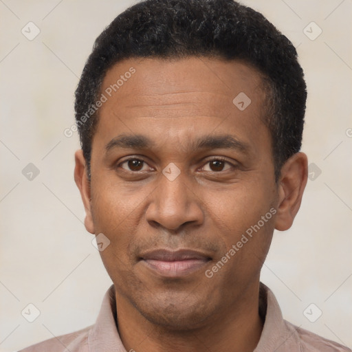 Joyful latino adult male with short  black hair and brown eyes