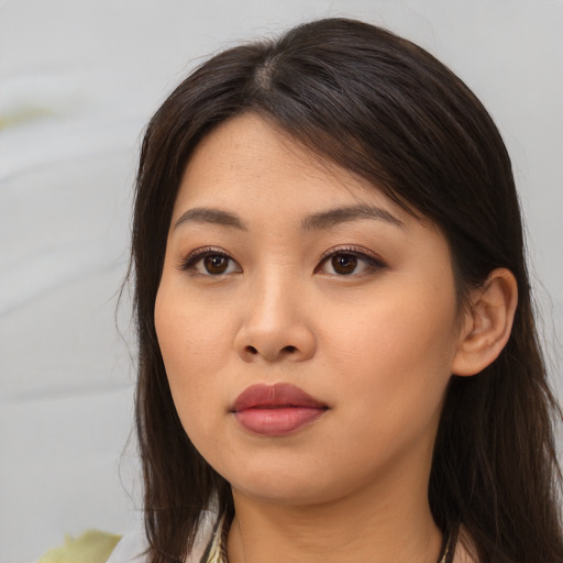 Neutral asian young-adult female with medium  brown hair and brown eyes