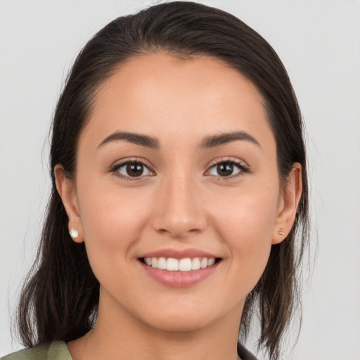 Joyful white young-adult female with medium  brown hair and brown eyes