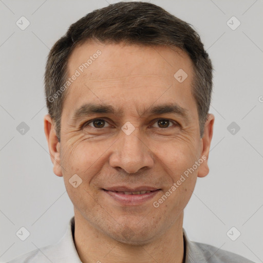 Joyful white adult male with short  brown hair and brown eyes