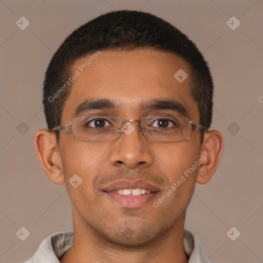 Joyful latino young-adult male with short  brown hair and brown eyes