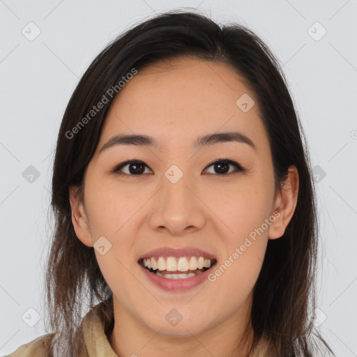 Joyful white young-adult female with long  brown hair and brown eyes