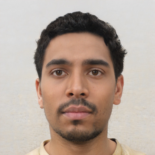 Neutral latino young-adult male with short  black hair and brown eyes