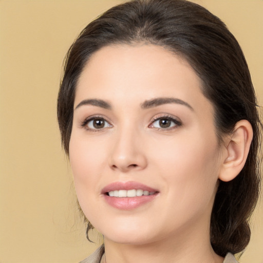 Joyful white young-adult female with medium  brown hair and brown eyes