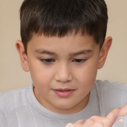 Joyful white child male with short  brown hair and brown eyes