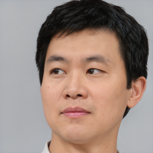 Neutral asian young-adult male with short  black hair and brown eyes
