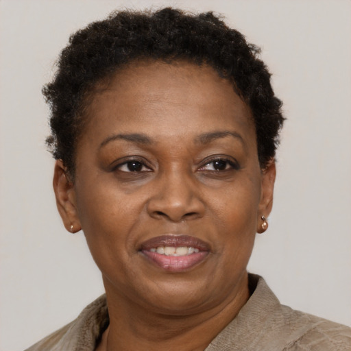 Joyful black adult female with short  brown hair and brown eyes