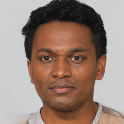 Neutral black young-adult male with short  black hair and brown eyes