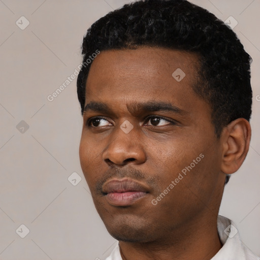Neutral black young-adult male with short  black hair and brown eyes