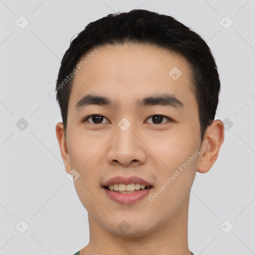 Joyful asian young-adult male with short  black hair and brown eyes