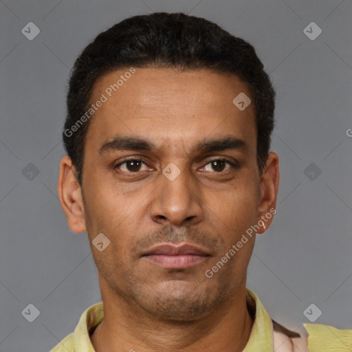 Neutral latino young-adult male with short  brown hair and brown eyes