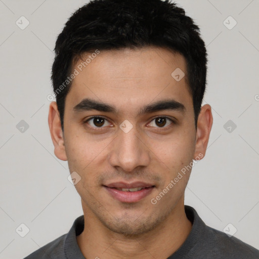 Joyful white young-adult male with short  black hair and brown eyes