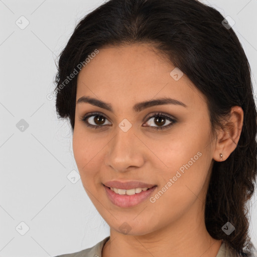 Joyful latino young-adult female with medium  brown hair and brown eyes