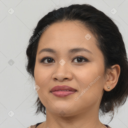 Joyful latino young-adult female with medium  brown hair and brown eyes