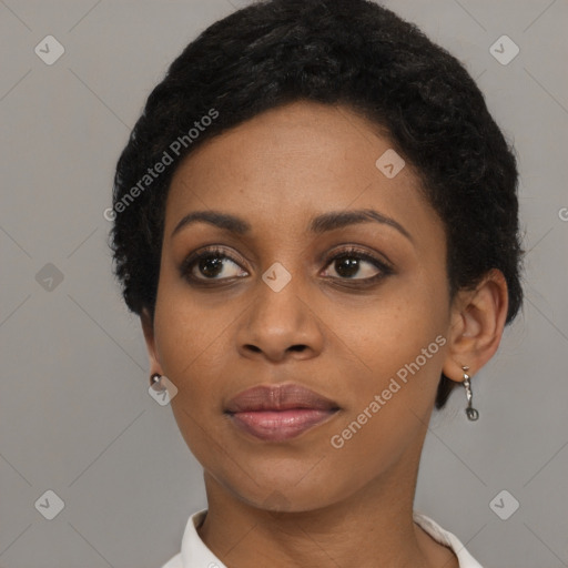 Joyful black young-adult female with short  brown hair and brown eyes