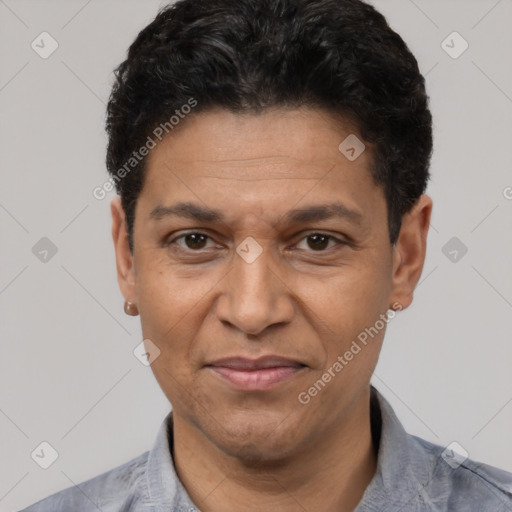 Joyful latino adult male with short  black hair and brown eyes