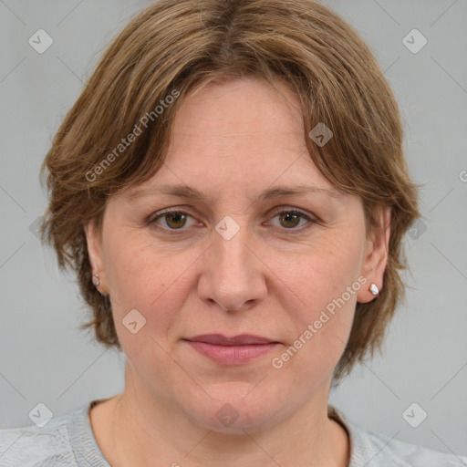 Joyful white adult female with medium  brown hair and blue eyes