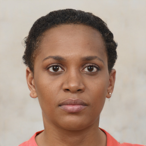 Neutral black young-adult female with short  brown hair and brown eyes