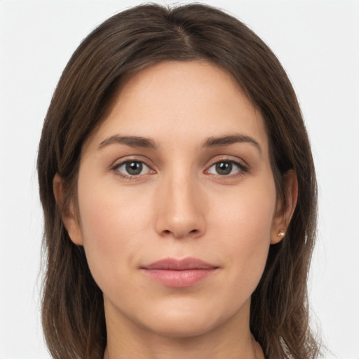 Joyful white young-adult female with long  brown hair and grey eyes