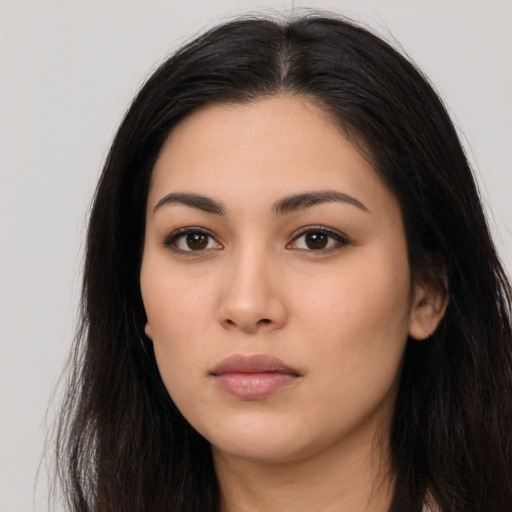 Neutral latino young-adult female with long  black hair and brown eyes