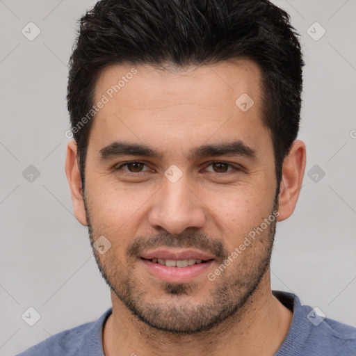 Joyful white young-adult male with short  black hair and brown eyes