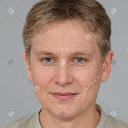 Joyful white adult male with short  brown hair and grey eyes