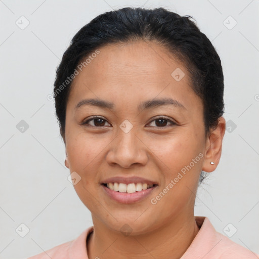 Joyful latino young-adult female with short  brown hair and brown eyes