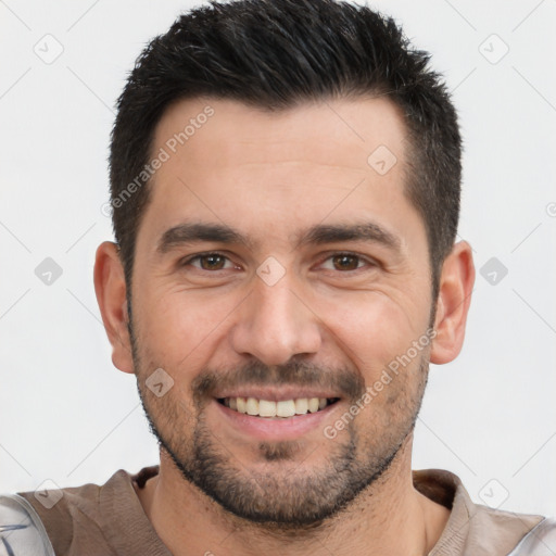 Joyful white young-adult male with short  black hair and brown eyes