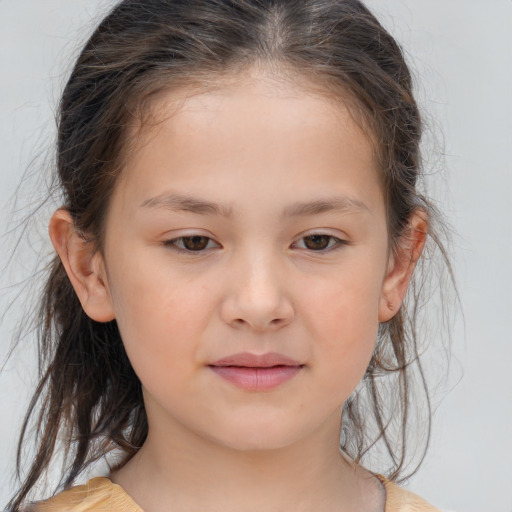 Joyful white child female with medium  brown hair and brown eyes