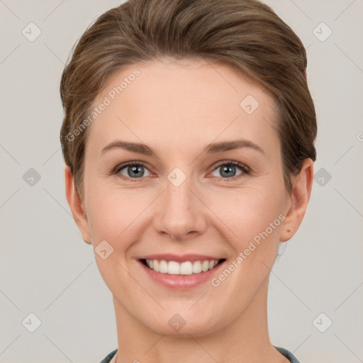 Joyful white young-adult female with short  brown hair and grey eyes